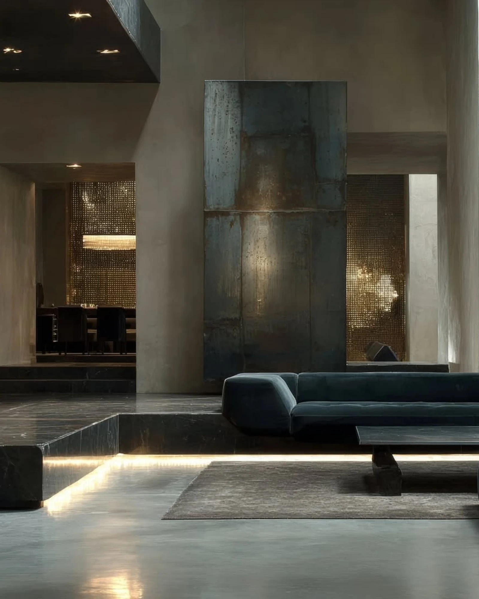 Interior contemporáneo con piedra natural, metal y luz cálida para Stone Küchë